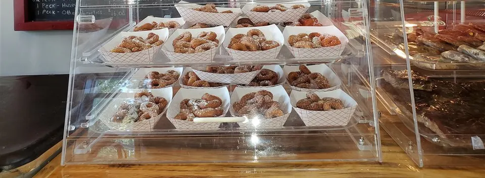 Trays of small donuts in the orchard farm store
